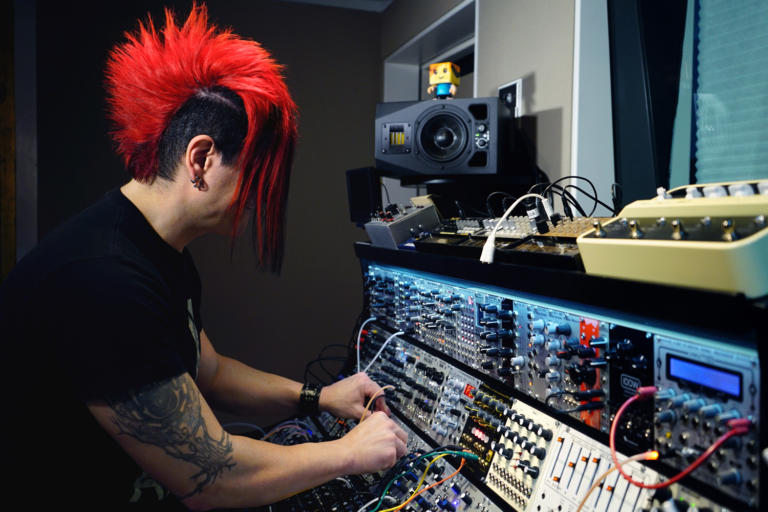 Celldweller and his ADAM A5X desktop monitor in his recording studio