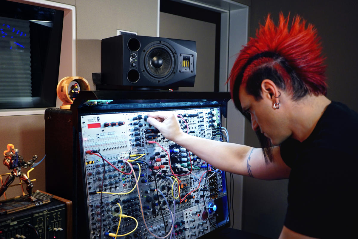 Celldweller and his ADAM A5X desktop monitor in his recording studio